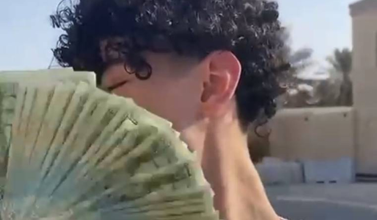 Insulting Qatari currency
